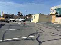 a parking lot with a truck in the middle of it
