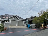 an image of a house with a red line in front of it