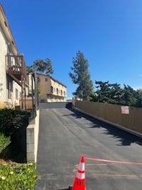 a road with a cone in the middle of it