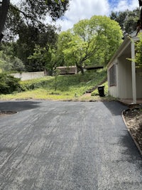 a driveway that has been paved with asphalt