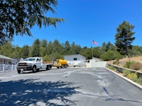 a white truck is parked in front of a house